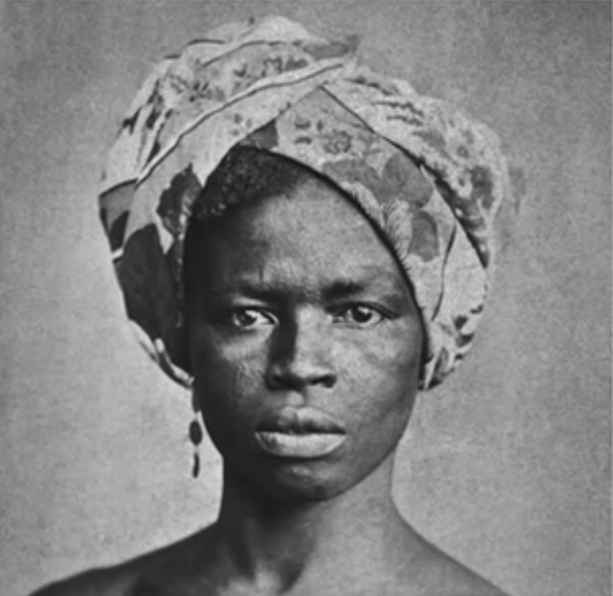 Portrait of an Afro-Brazilian woman wearing a turban, photographed in Brazil circa 1870.